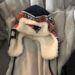 A patriots winter hat with stings